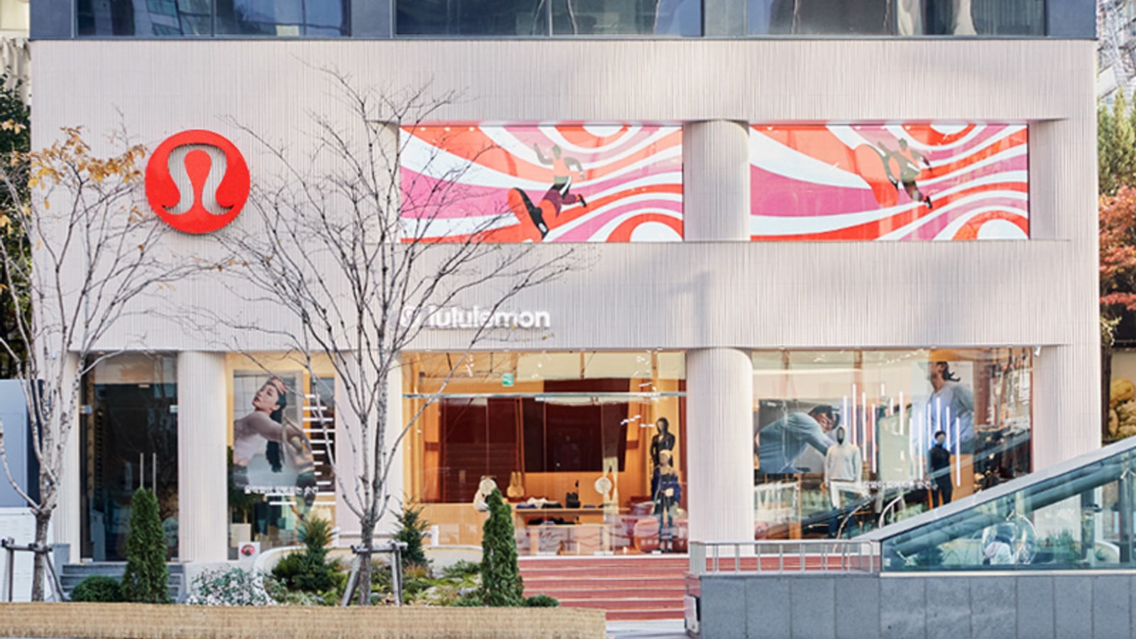lululemon Gangnam flagship exterior with the round symbol, apparel displays, and street frontage.