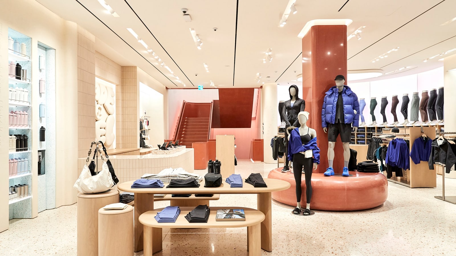 lululemon Gangnam interior showing men’s and women’s technical apparel in a unified store system.