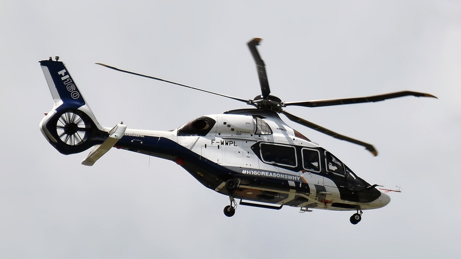 Airbus H160 helicopter in flight during a public demonstration.