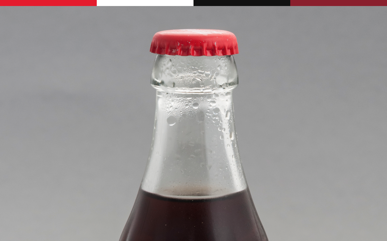 Coca-Cola glass bottle cropped as a cold package-recognition proof surface.