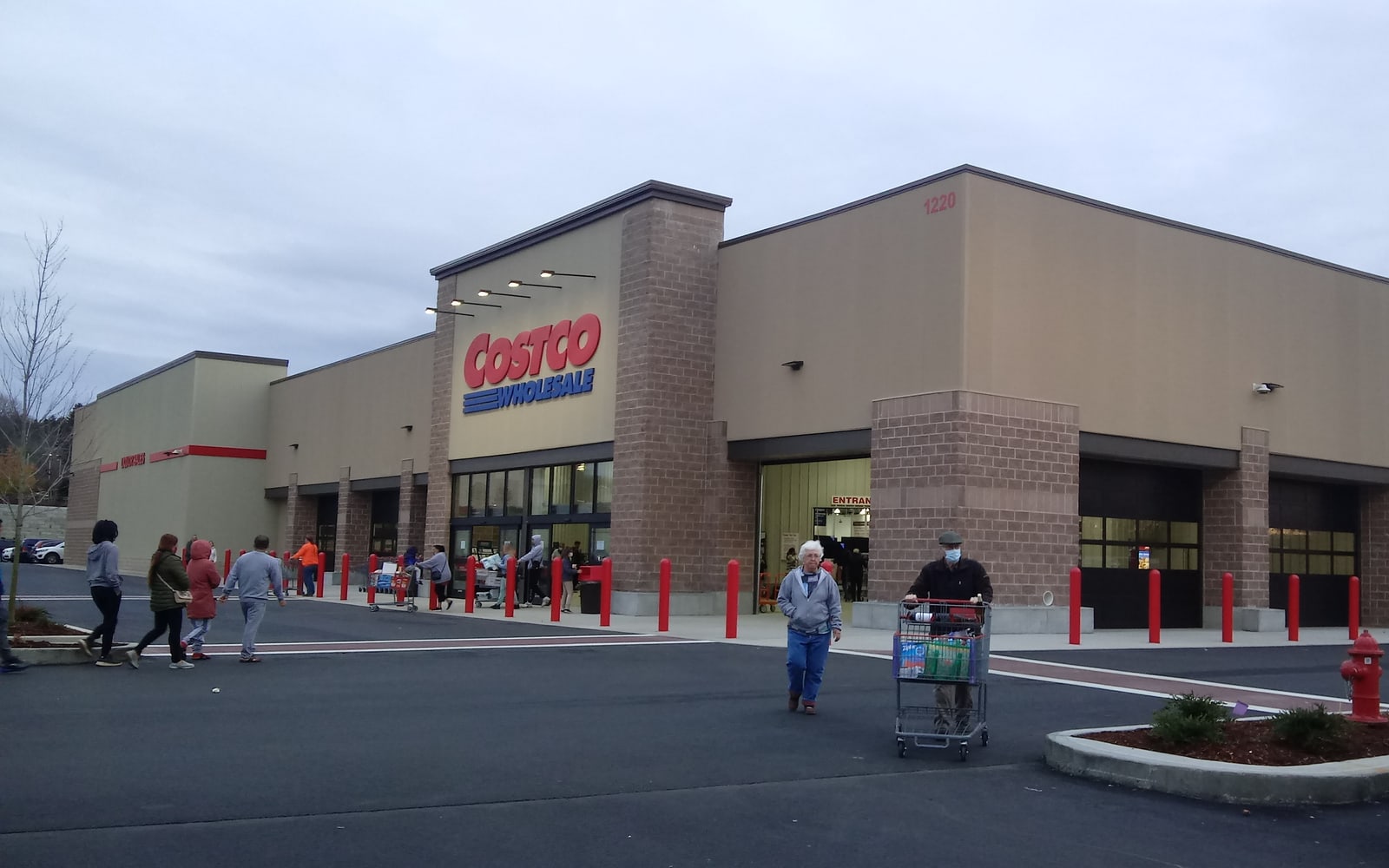 Costco warehouse exterior with sign and large-format retail building.