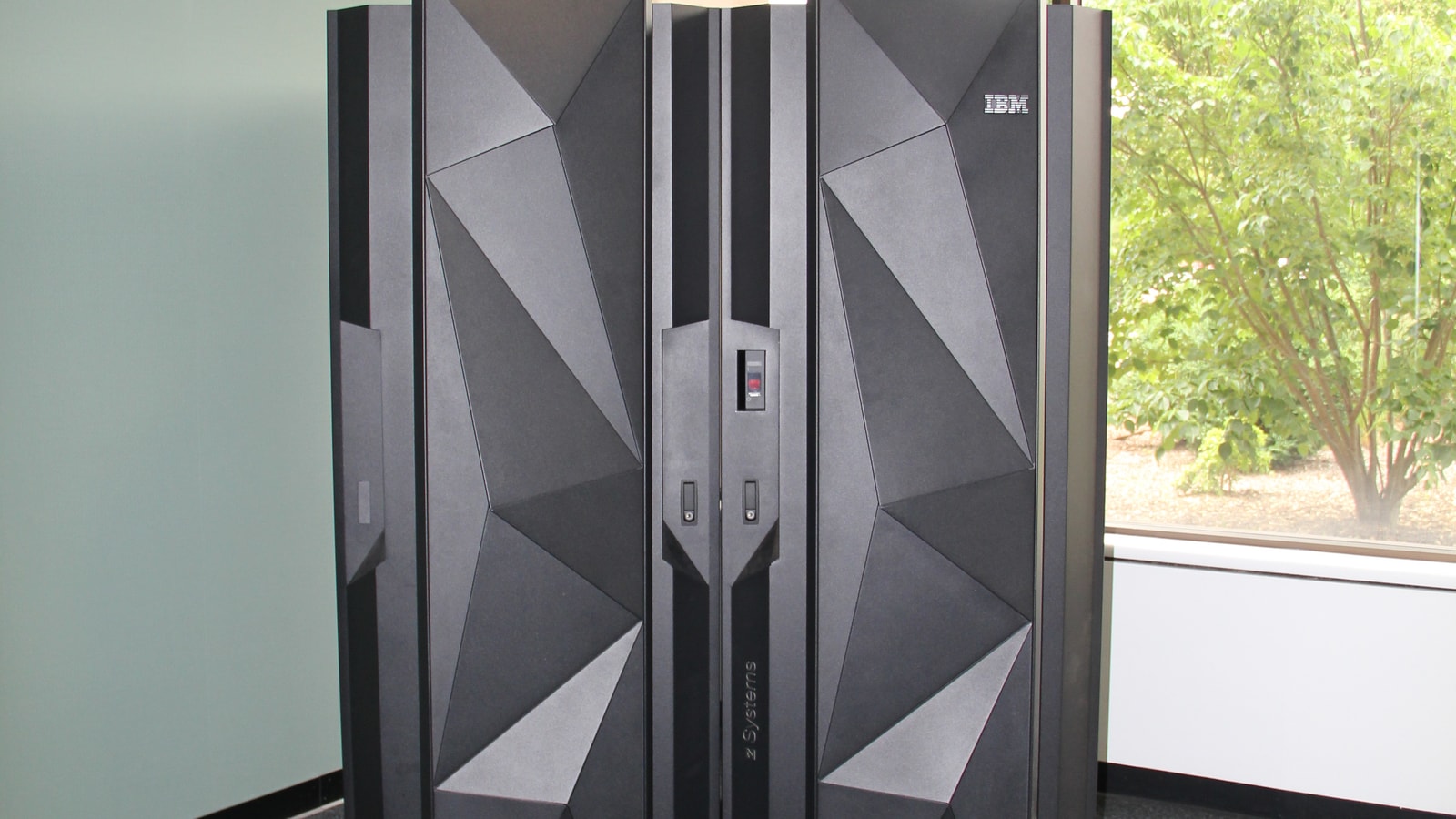 IBM z14 mainframe cabinet with geometric black front panels.