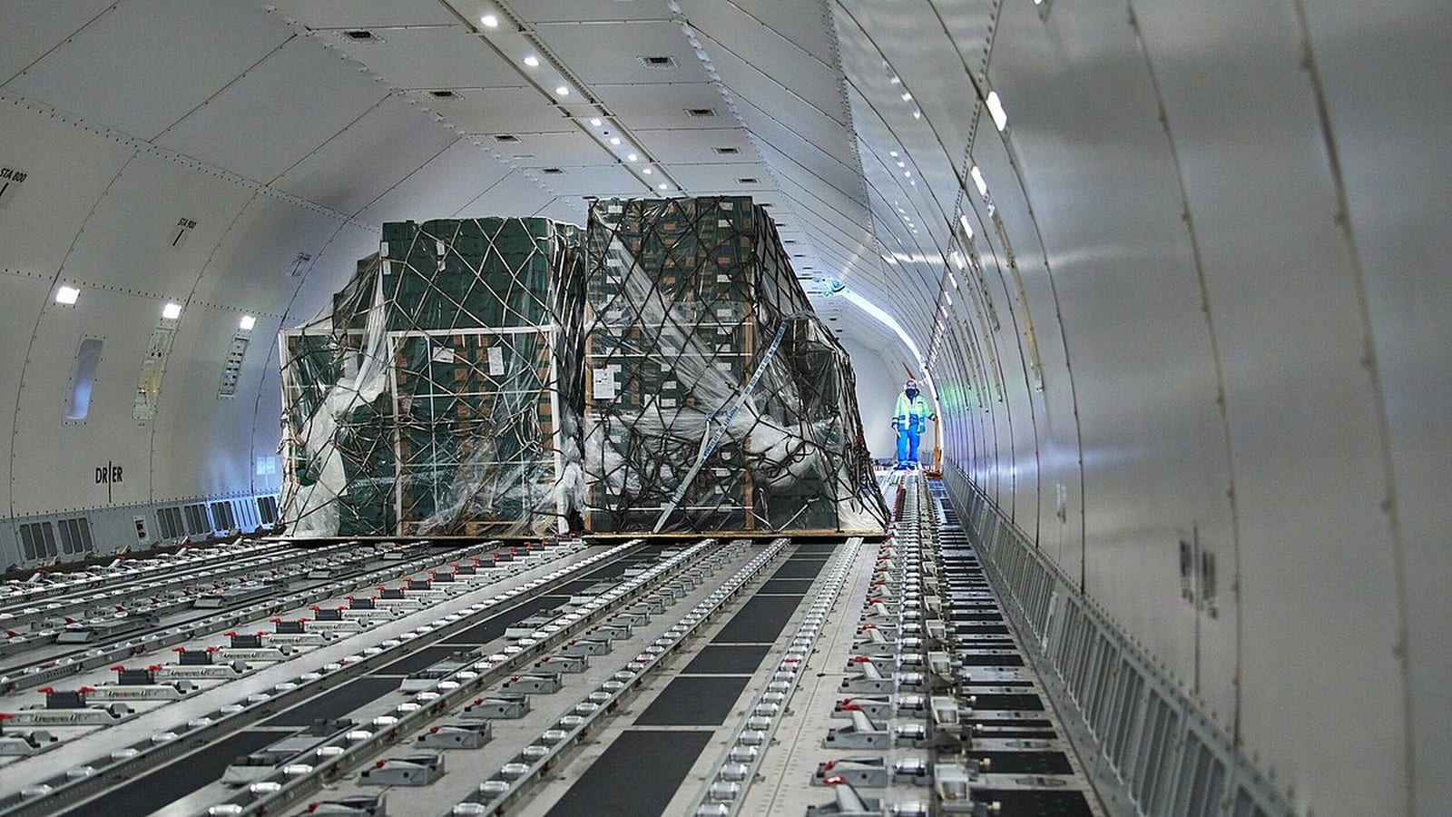 Palletized freight secured inside a Lufthansa Cargo aircraft hold.