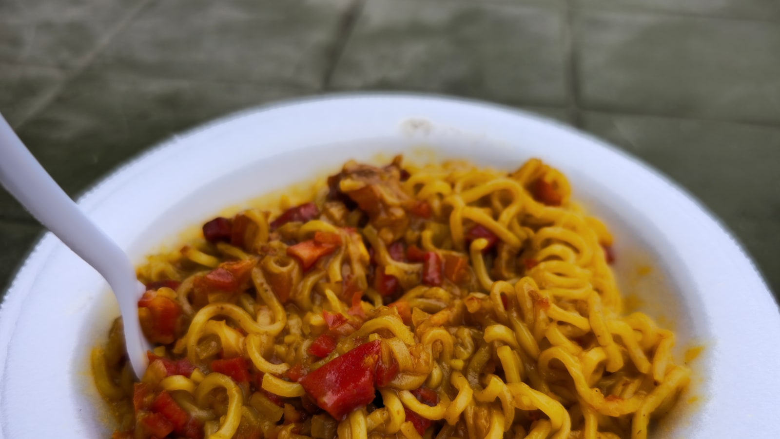 Bowl of Maggi noodles with vegetables.