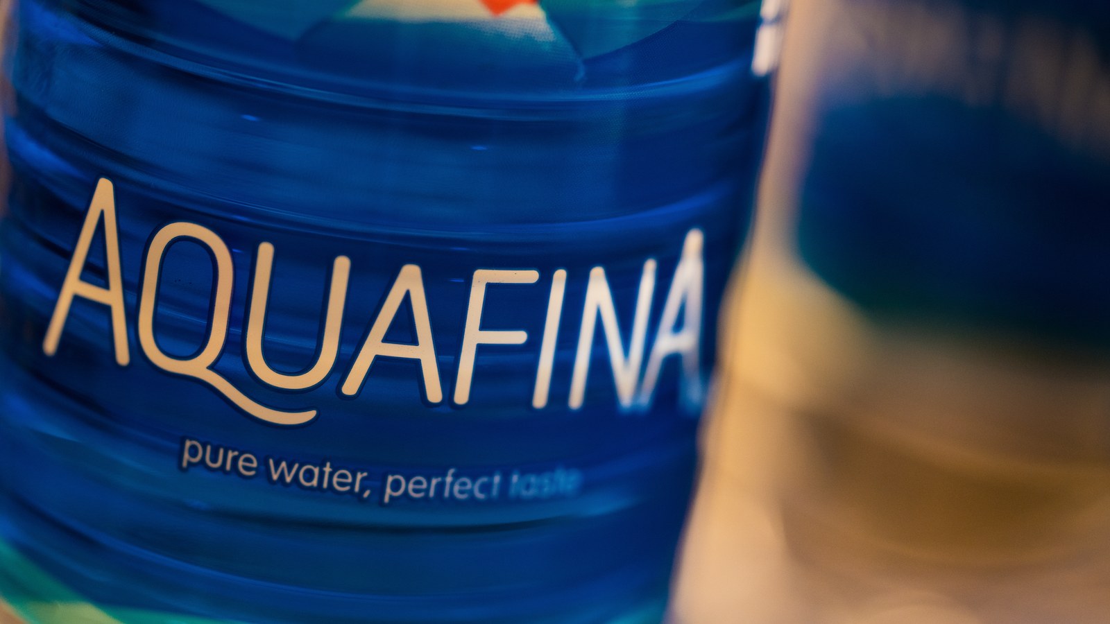 Aquafina water bottle showing PepsiCo water portfolio proof.