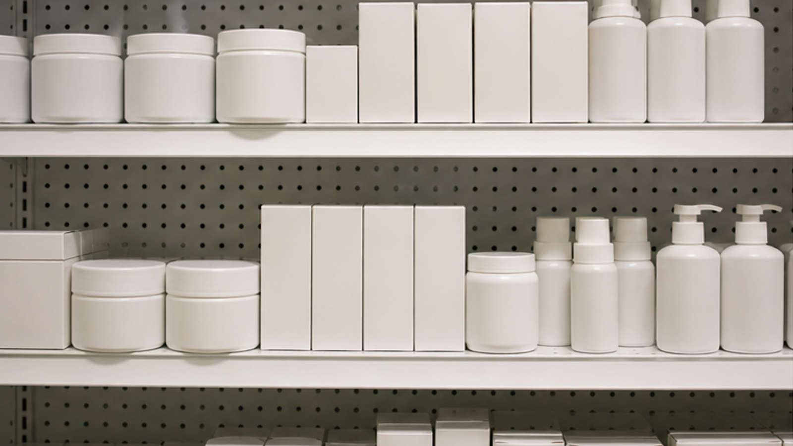 Blank generic health packaging on a drugstore shelf.