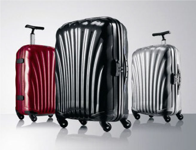 Samsonite hard-shell luggage family in red, black, and silver from the brand's official history.