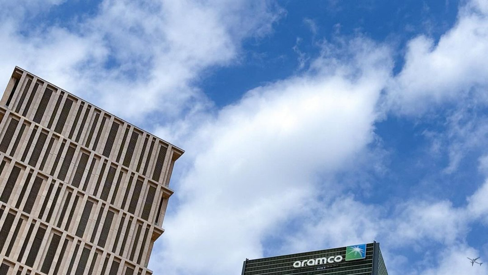 Saudi Aramco tower cropped to show corporate building scale and market presence.