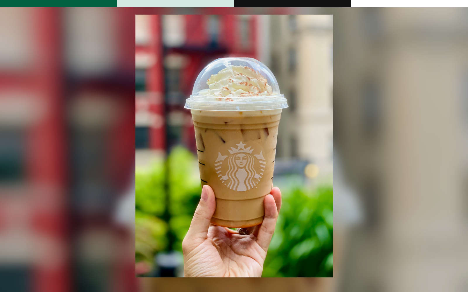 Starbucks storefront with green siren sign and retail service context.