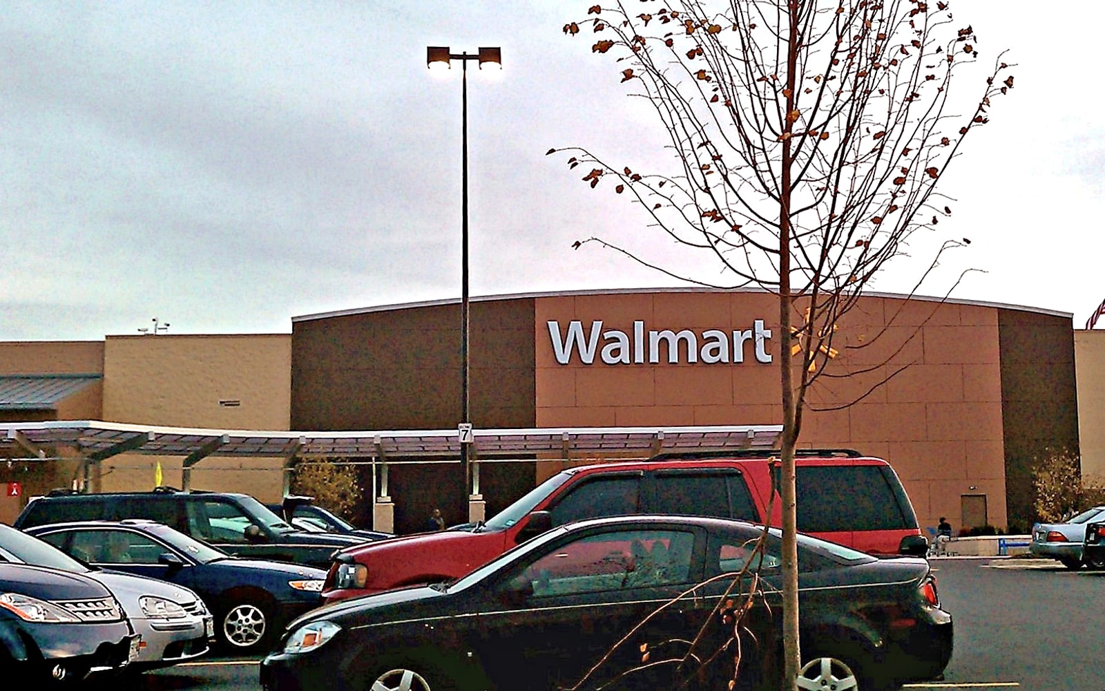 Wide remodeled Walmart Supercenter frontage with large retail scale.
