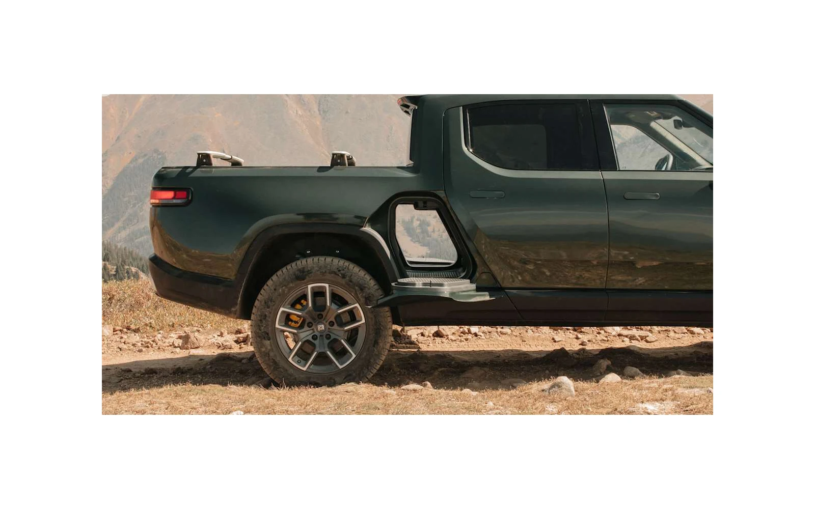 Rivian vehicle charging outdoors