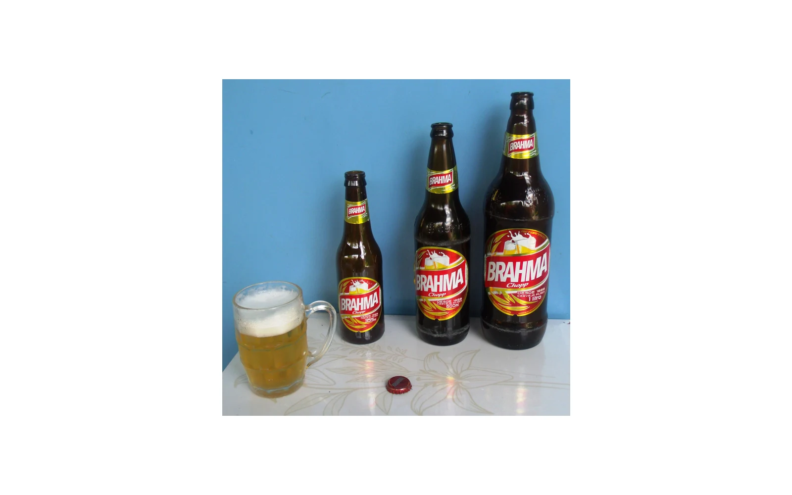 Brahma beer bottles and a glass
