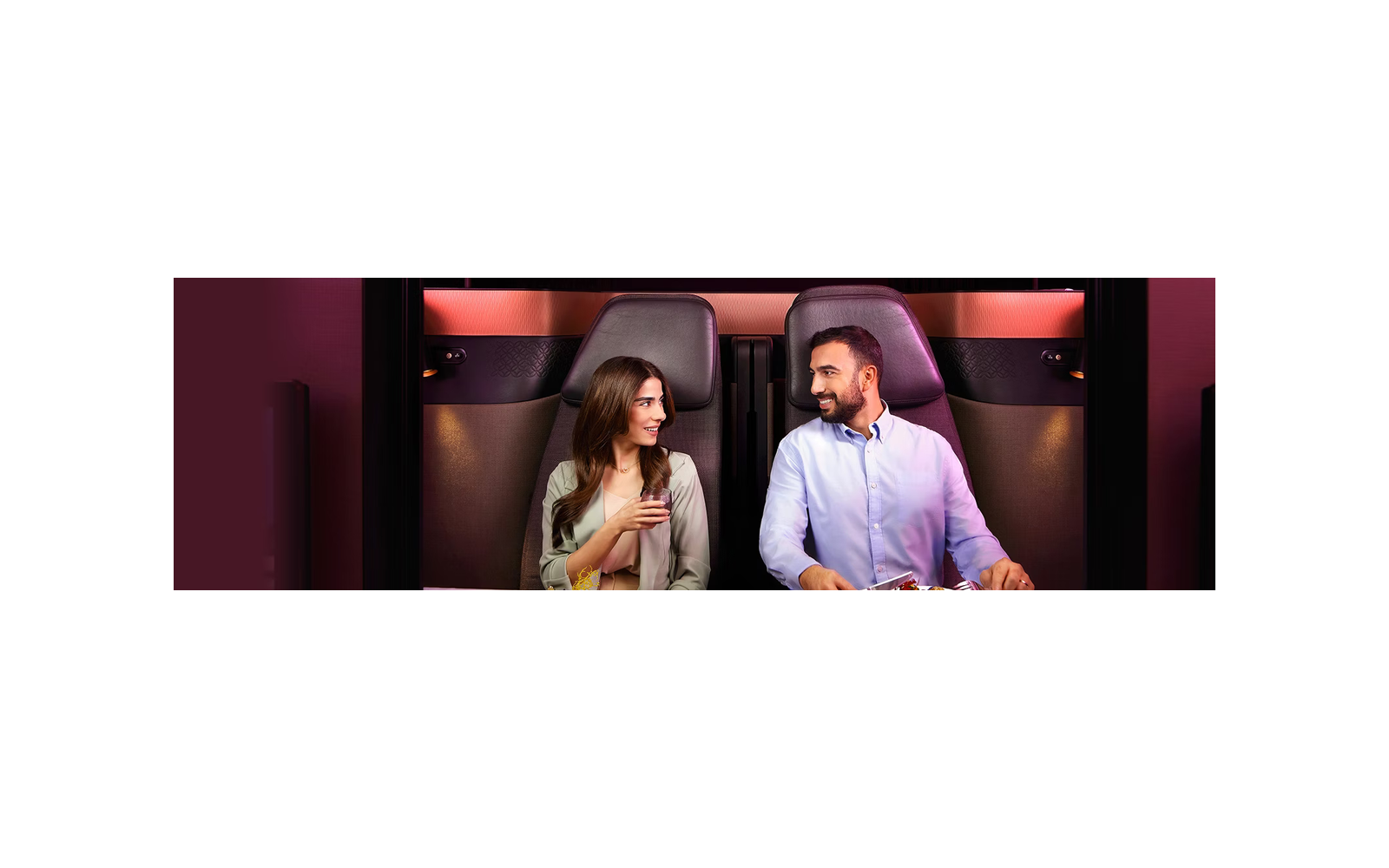 Qatar Airways business-class cabin with two passengers