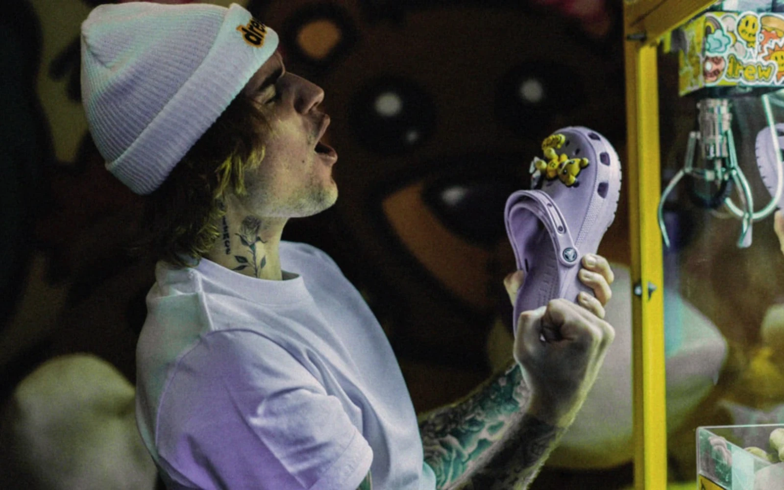 Justin Bieber holds a lavender Crocs Classic Clog fitted with Jibbitz charms.
