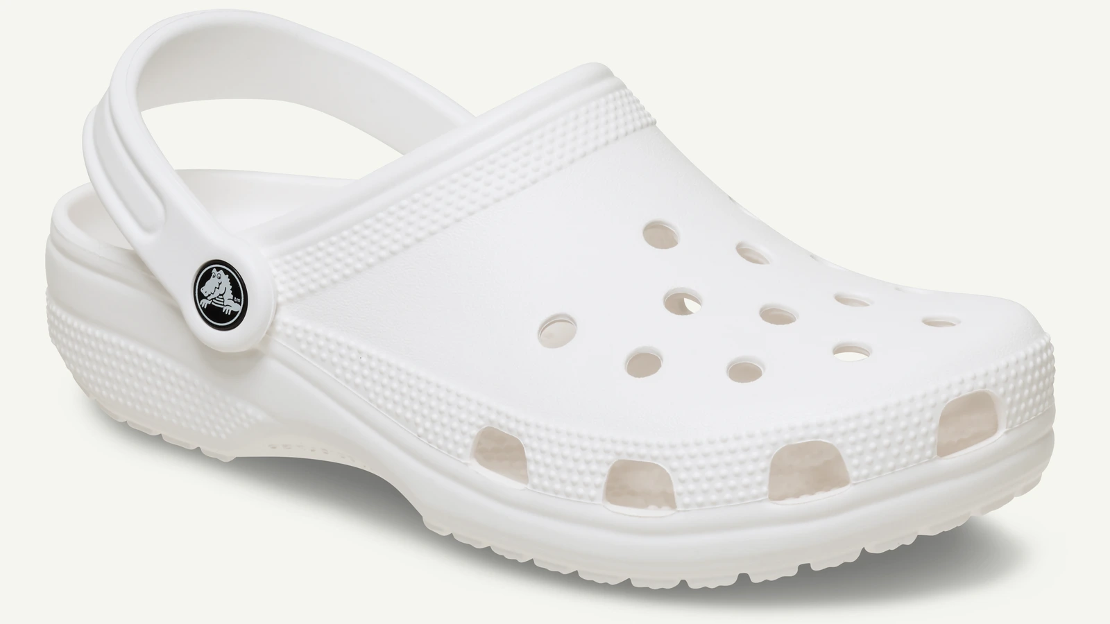 White Crocs Classic Clog shown in profile on an off-white field.