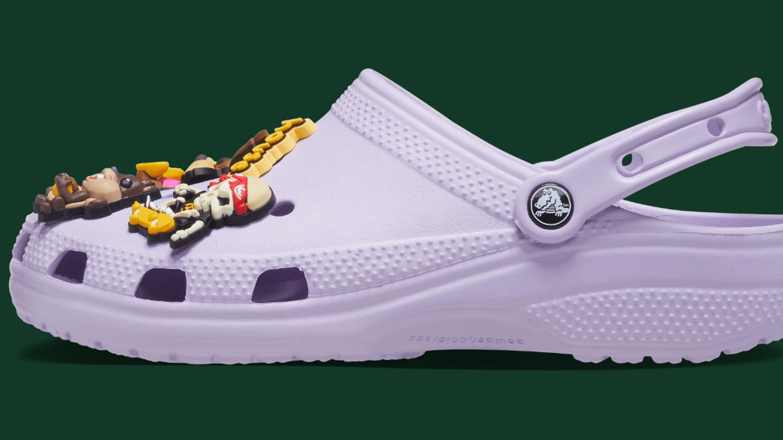 Lavender Crocs Classic Clog fitted with character Jibbitz charms.