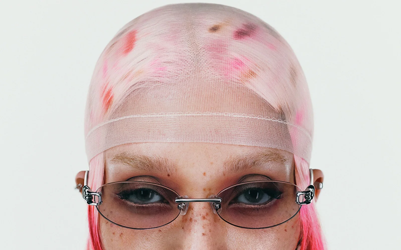 Close portrait wearing silver Gentle Monster folding eyewear from the 2026 Veggie Collection.