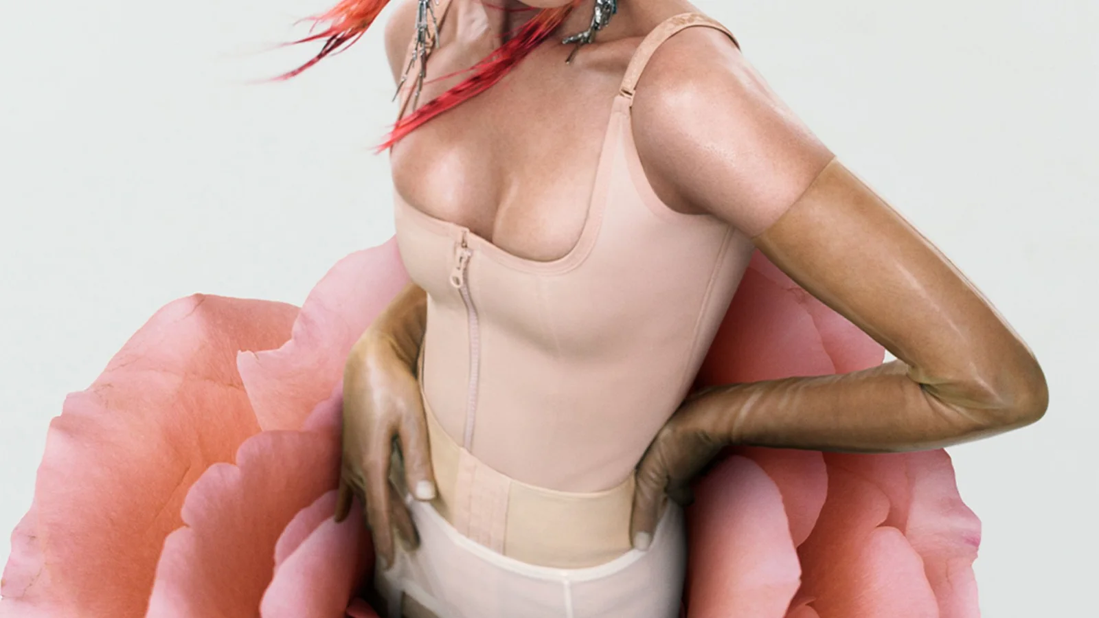Cropped blush campaign look against a sculptural pink floral form in the 2026 Gentle Monster Veggie Collection.