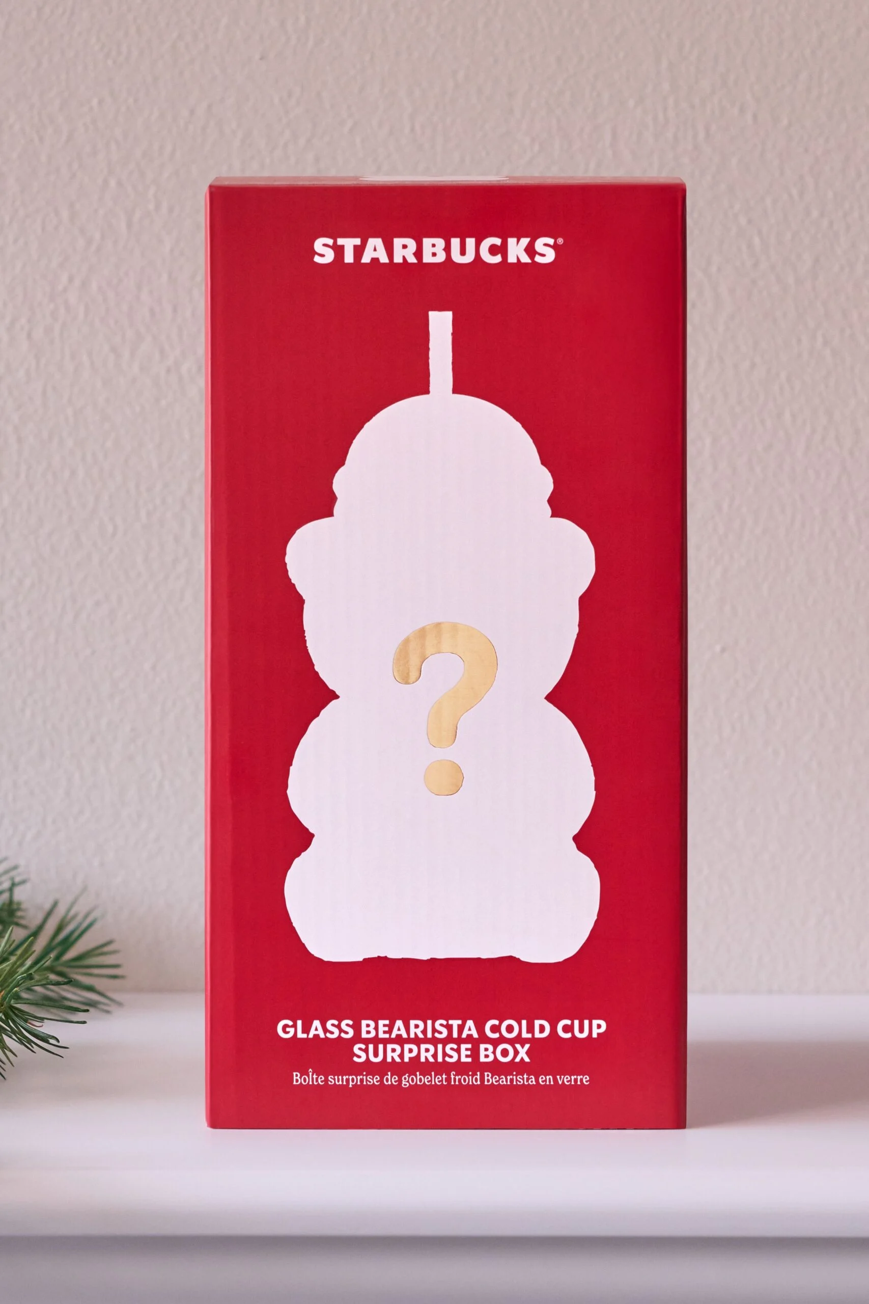 Red Starbucks Bearista Surprise Box packaging with a bear-shaped silhouette and question mark.