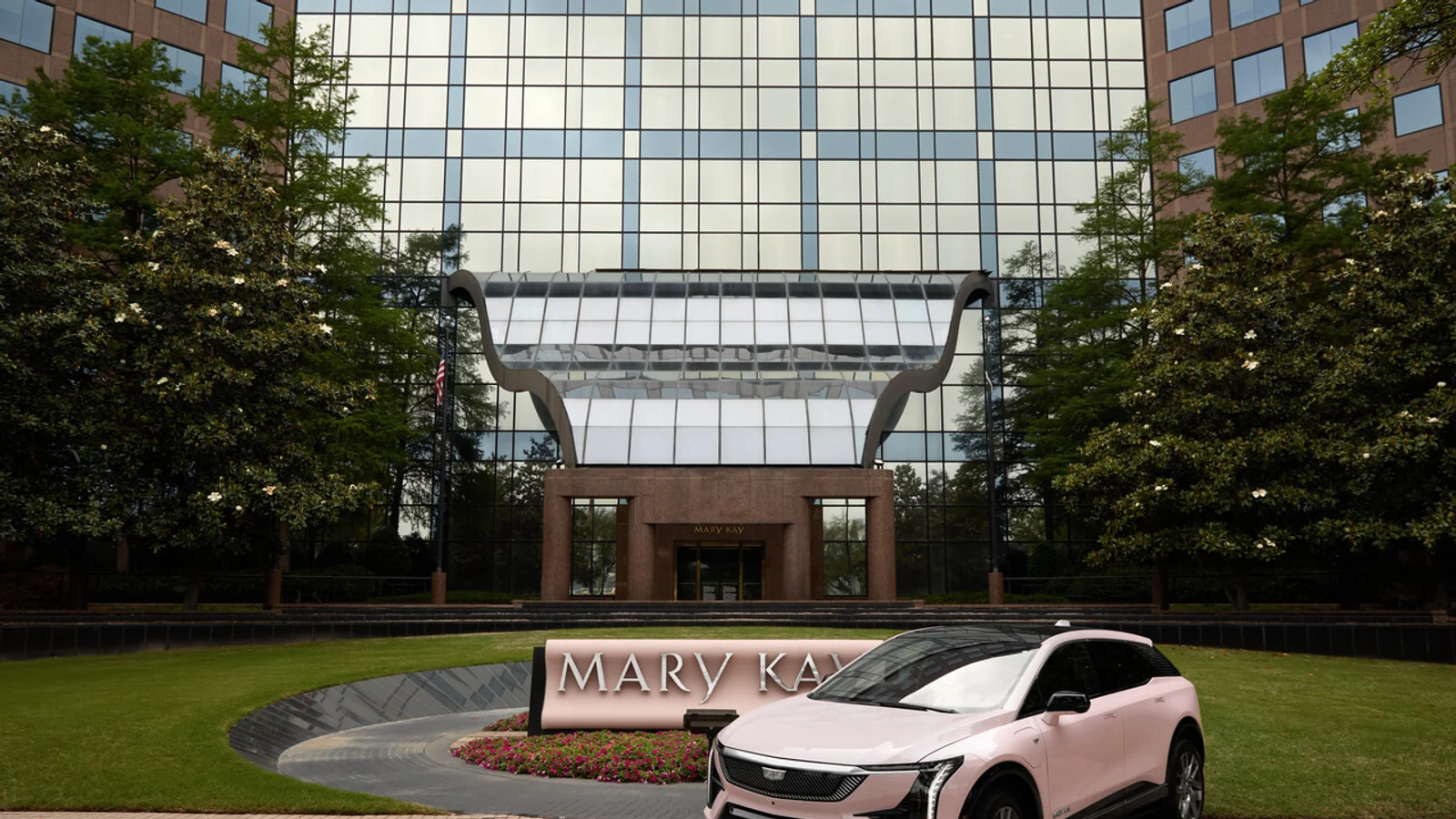 Pink Mary Kay Cadillac Optiq outside the company headquarters.