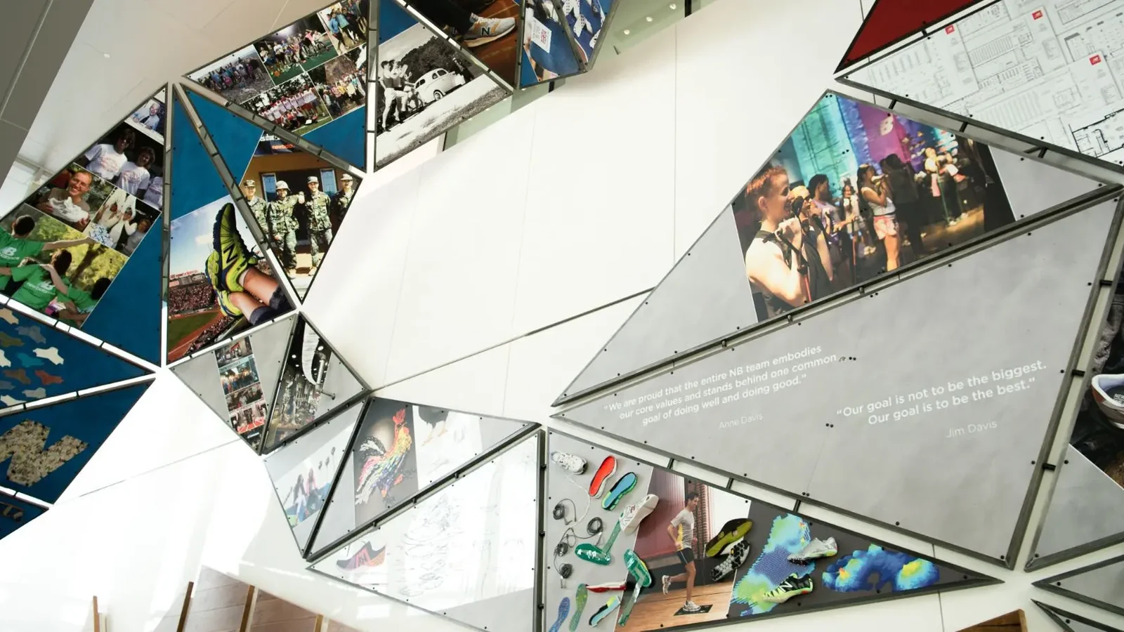 New Balance workplace installation with campaign and community images.