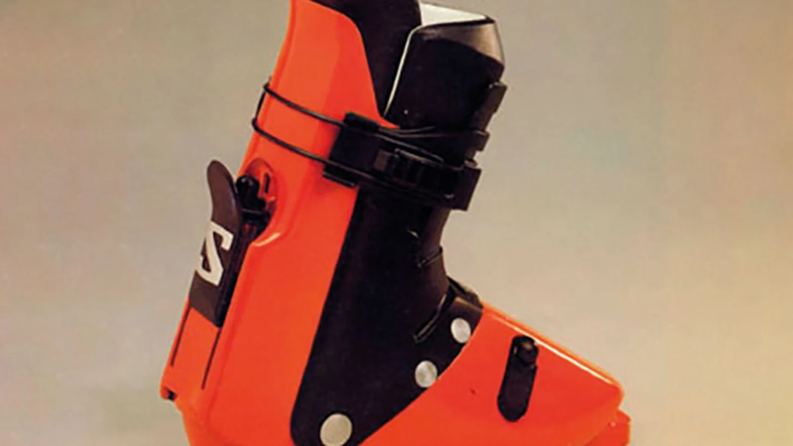 Archival red Salomon SX90 ski boot advertisement.
