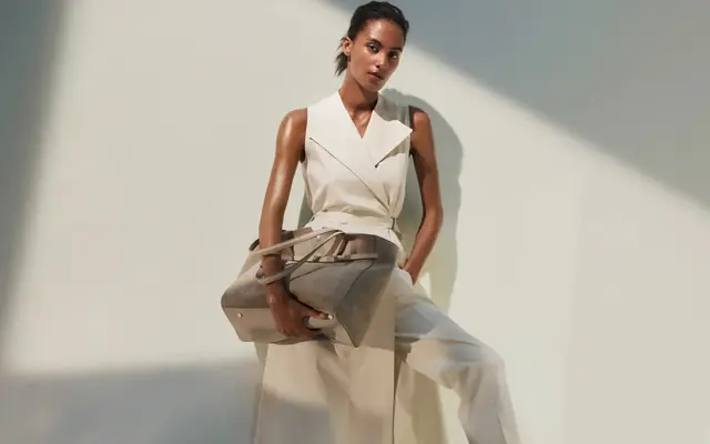 Hugo Boss campaign scene with tailored clothing and luxury apparel styling.