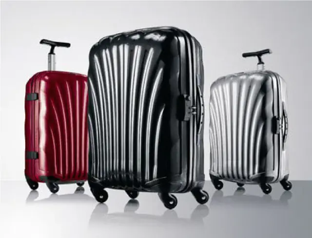 Samsonite hard-shell luggage family in red, black, and silver from the brand's official history.