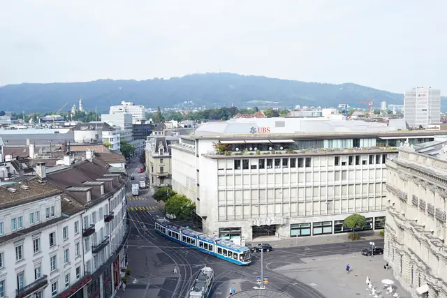UBS at Paradeplatz in Zurich, with the official building mark visible above the city square.